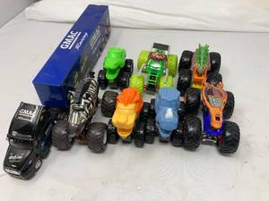 lot 122 image: LOT OF 7. 6 ANIMAL THEMED MONSTER CARS AND 1 RACING GMAC INSURANCE SEMI