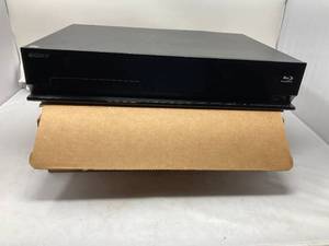 lot 138 image: SONY DVD AND BLUE RAY PLAYER  WITH A BOX OF DVDS. DVD PLAYER IS IN GREAT CONDITION