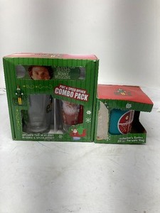 lot 242 image: LOT OF 2 BOTH STILL IN ORIGINAL BOXES. 1) THE MOVIE ELF 2 PINT GLASSES AND A SPEED OPENER COMBO SET. 2) THE MOVIE ELF 12OZ MUG.