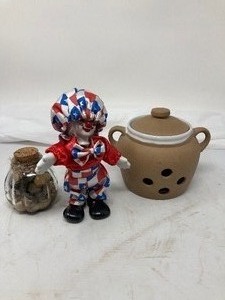 lot 232 image: 3-Piece Lot   1)Sandstone potpourri holder, 5,5T  2) Colorful Rocks in jar, 3T.  3) Red & White, Porelain & Satin Clown, 7T