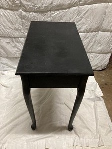 lot 239 image: BLACK WOOD ENTRY TABLE WITH ONE DRAWER.  22T x 28W