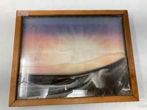 lot 202 image: MOVING SAND ART IN WOODEN FRAME WITH LAZY SUSAN ON THE BACK.14.75L x 11.75W x 1.75D.