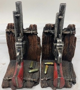 lot 145 image: UNIQUE AND BEAUTIFUL PISTOL BOOKENDS . Each piece is 8T x 4.5W x 4D.