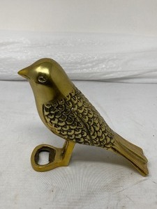 lot 149 image: HALLMARK HOME BRAND - SOLID BRASS MAGPIE BOTTLE OPENER. . 4.75T x 5W x 2.25D