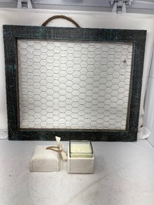 lot 298 image: Wall dcor for home 24 x 24wood frame with wire mounted on back. Has a rope hanger AND a scented candle in original box.