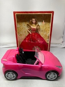 lot 300 image: 2014 Holiday Barbie in long red dress. In original box. With pink car. Barbie is 12T  8W.  Car is 14L 7 7 W.