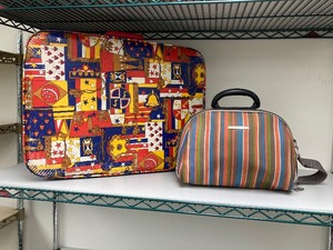lot 182 image: VINTAGE SUIT CASE AND TRAVEL BAG. SUIT CASE IS HARD COVER 23.5L x 16.5W x 6D. TRAVEL BAG IS A SEMI HARD CASE THAT MEASURES 13T x 13L x 7.75.