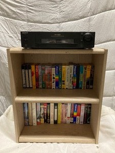 lot 194 image: WOOD CABINET27T x 23W. & SONY VCR PLAYER AND 30 VCR TAPES. PLAYER IS 3T x 17W.