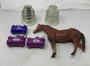 lot 168 image: 4 Piece Lot  1)Glass Insulator 4T   2)  Glass Insulator 4T  3) 3  Containers for new doggy waste bags 4) Cast Iron Horse-one foot missing