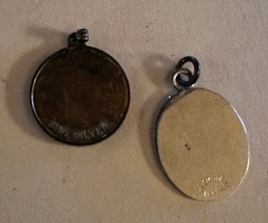 lot 151 image: Sterling pendant engraved JC and  sterling lockeed C130 Hercules pendant