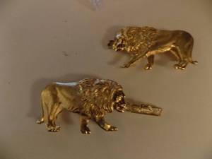 lot 159 image: Pair of lion belt buckles gold