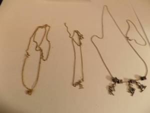 lot 199 image: Charms on necklace and gem necklace Gemini