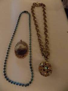 lot 204 image: gold chain with jeweled ball drop and another necklace drop
