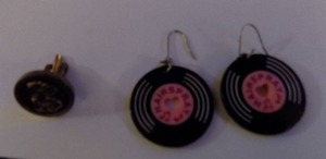 lot 207 image: Hairspray earrings plus 1 comedy tragedy cufflink