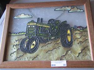 lot 30 image: Stain glass framed tractor photo