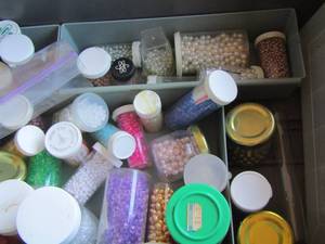 lot 229 image: small jars of mini beads various colors