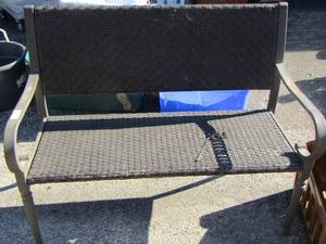 lot 4 image: Patio wicker bench has small hole just need cushions