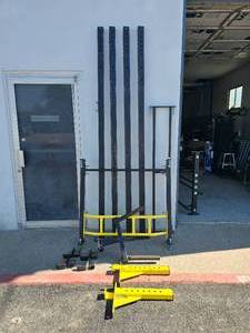 lot 40 image: Northern Lights Complete Power Rack w Dip Bar, J Hooks, Yellow Pull Up Bars, Yellow Squat Spotters Arms & Extension Arm (Extension is used to connect multiple racks together)