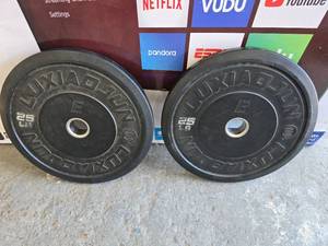 lot 90 image: Lot of 2 Luxiaojun 25lb E1 Bumper Plates