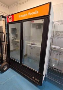 lot 5 image: True GDM-49F Two Section Display Freezer w Glass Swinging Doors