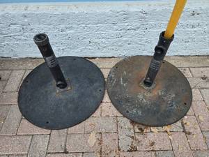 lot 56 image: Lot of 2 Heavy Steel Weighted Umbrella Stands