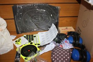 lot 79 image: Target papers, shooting headgear, ammo and casings