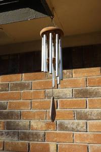 lot 171 image: Wind chime and outdoor solar lights (bring tools to remove)