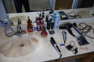 lot 163 image: Hair dryer, flat iron, razor and more