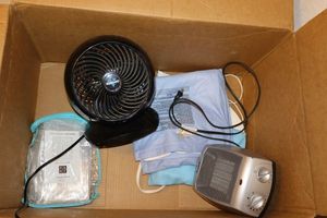 lot 126 image: Personal heater, heating pads, and Vornado fan. Plus shower curtain