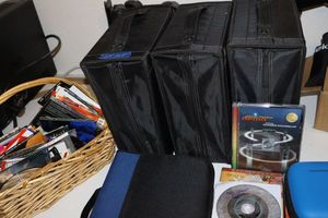 lot 105 image: Generous amount of CDs and travel carriers