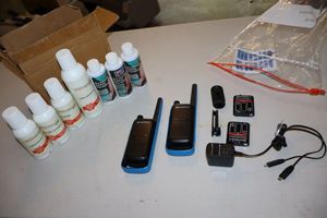 lot 214 image: Two way radios and leatherfabric cleaner