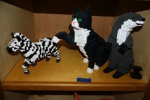 lot 22 image: JEKCA Lion Animal Plastic Building Blocks  Age 14. Zebra, cat, and otter.
