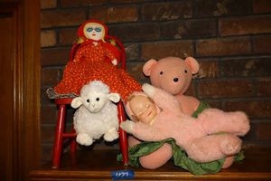 lot 27 image: Dolls and bear. Pink doll plays music, red doll is reversible.