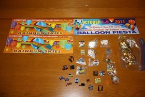 lot 11 image: Balloon Fiesta bumper stickers and pins
