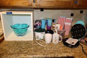 lot 41 image: Express Mini donut maker, Popcorn boxes, Rival Little Dipper mini crock pot, glassware, bowl glass bowl
