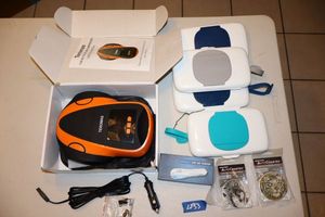 lot 53 image: Car accessories Teromas portable air compressor, Absorba Stone auto coasters, portable car air purifier, handi-wipes containers