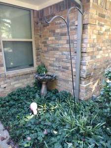 lot 217 image: Cement bird bath, Shepherds hook and yard flamingo