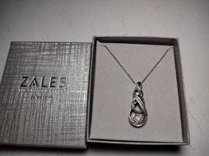 lot 218 image: Jewelry Sterling silver 925 infinity twist pendant necklace. (has Zales box and tag as shown)