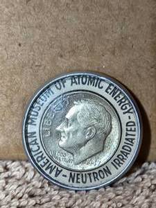lot 111 image: Encased neutron irradiated 1947 Silver Roosevelt Dime - American Museum of Atomic Energy