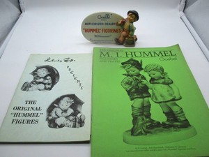 lot 78 image: Goebel Hummel Figurine and Books