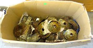 lot 211 image: LARGE BOX OF COILED ROOFING NAILS AS SHOWN.