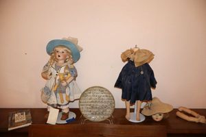 lot 15 image: Dolls (includes singing Crystal doll) plus music plate and praise book