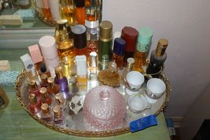 lot 85 image: Vintage vanity mirror tray with perfumes and more