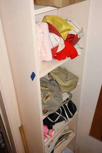lot 98 image: unopened blanket, hats, bags, and clothes hangers