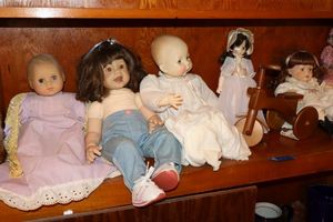 lot 107 image: Vintage dolls and wooden tricycle