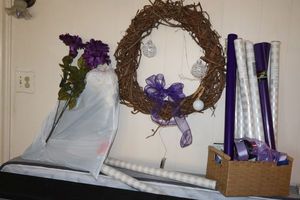 lot 110 image: Purple and white decorations, gift wrap and wreath