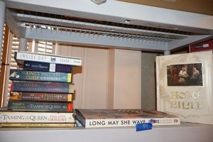 lot 54 image: Books vintage family Bible, Long May She Wave, and novels