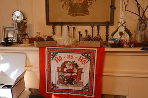 lot 62 image: Christmas scarf, brass candle holders, pine cone candles, and more