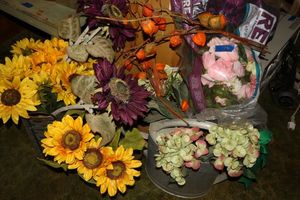 lot 128 image: Artificial flowers with watering cans