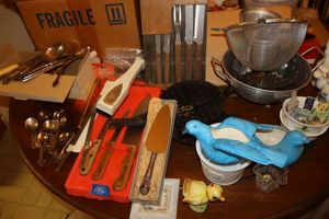 lot 186 image: Misc. kitchen items cast iron waffle maker, knives, ceramic figurines, and more